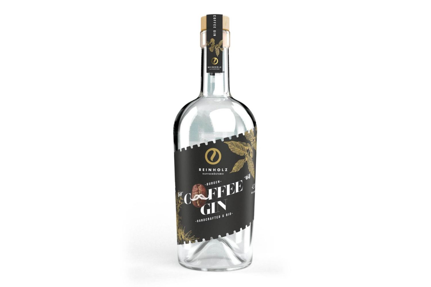Transparente Glasflasche mit schwarzem Etikett, Aufschrift "Coffee Gin" von Reinholz, verziert mit goldenen Kaffeebohnen.