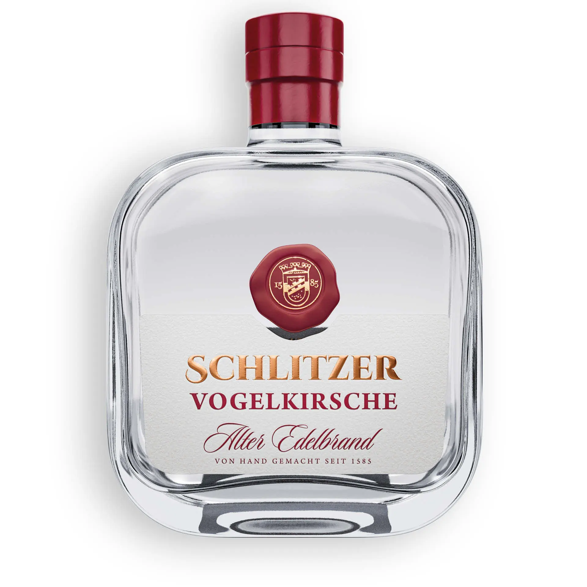 Alter Vogelkirschen Brand in stilvoller Glasflasche – Schlitzer Destillerie Flasche Alter Vogelkirschen Brand der Schlitzer Destillerie mit goldfarbenem Etikett und rotem Siegel, vor weißem Hintergrund – edler Kirschbrand in hochwertiger Verpackung