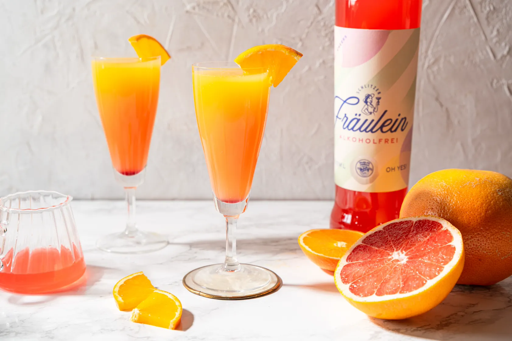 Schlitzer Virgin Sunrise – alkoholfreier Sunrise-Cocktail mit Fräulein Alkoholfrei, Orangensaft und Grenadine